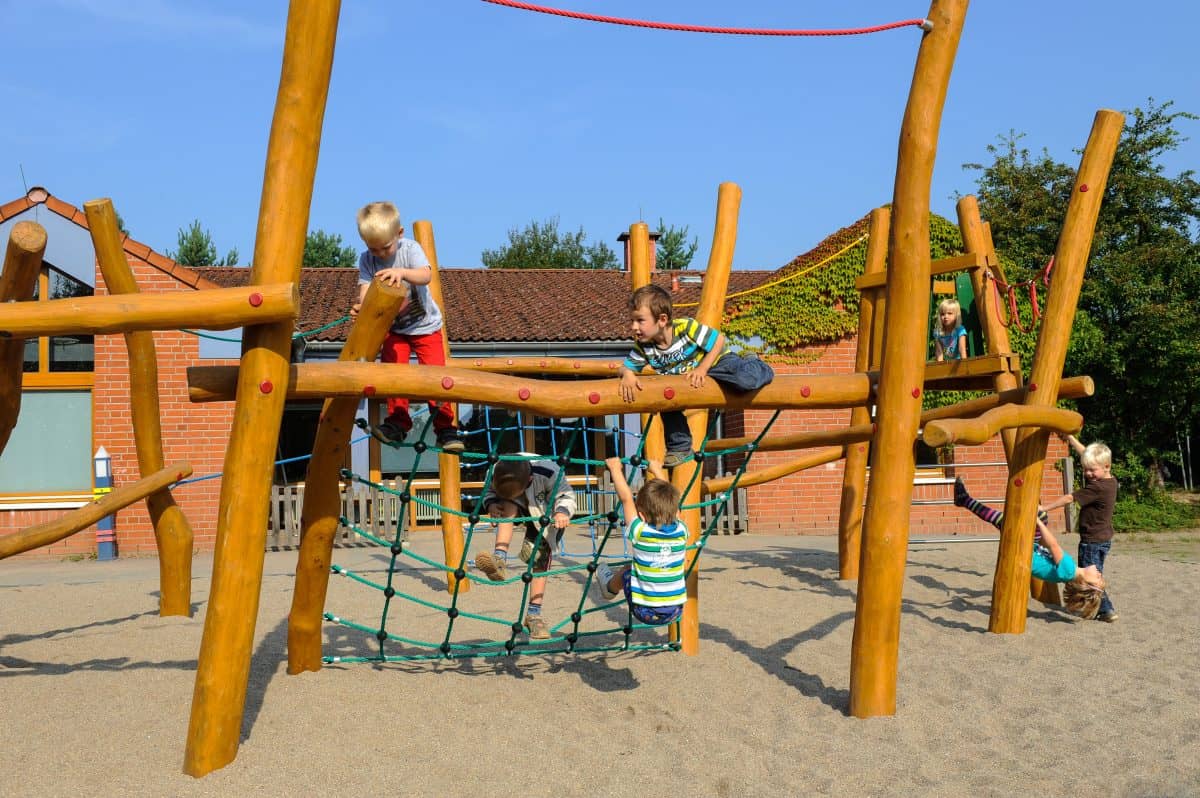Children climb on the nursery’s climbing frame